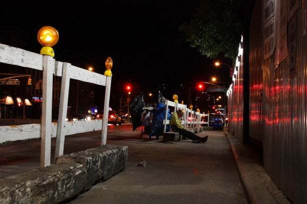 man sleeping on street