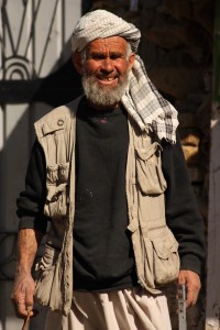 man with chair and beads